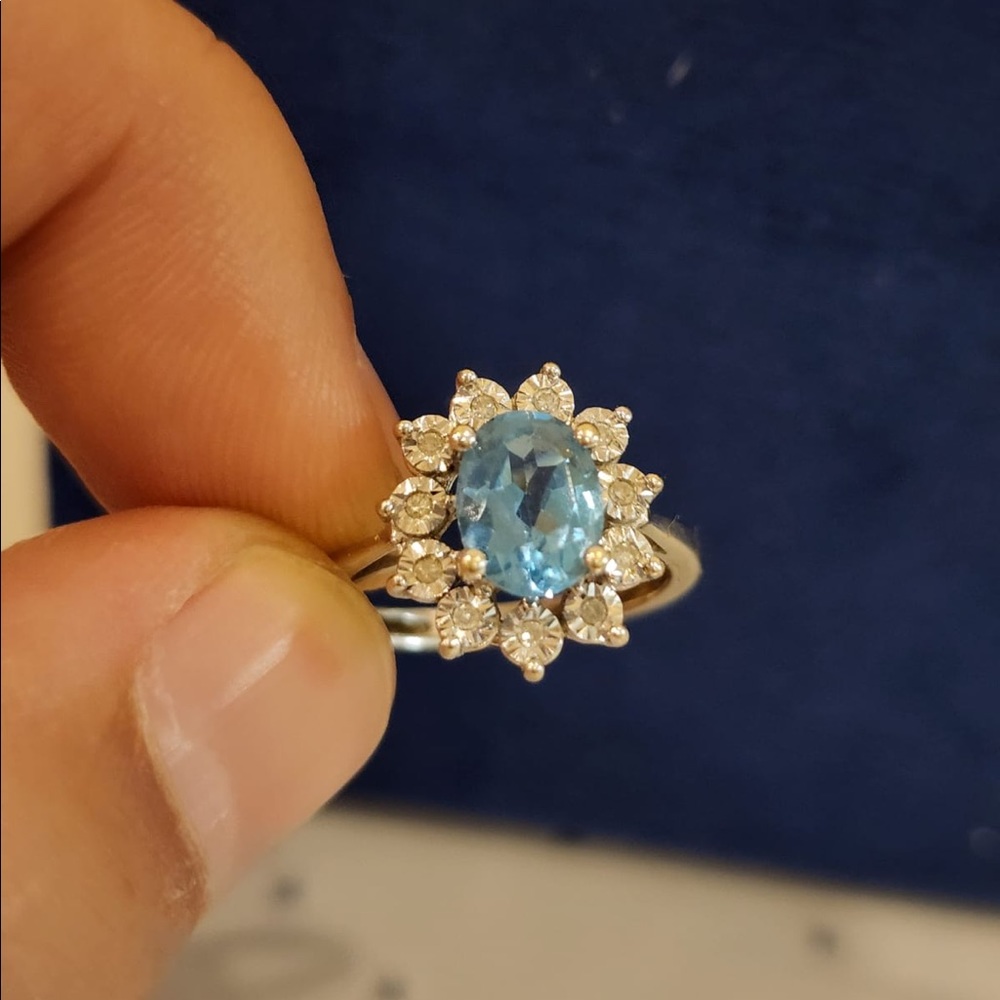 14k White Gold Ring With Blue Topaz& Diamonds around it. Size 6.